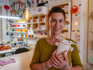 woman smiling plush toy workshop